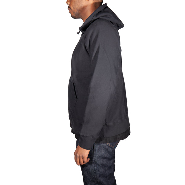 Person wearing a dark gray jacket on a white background