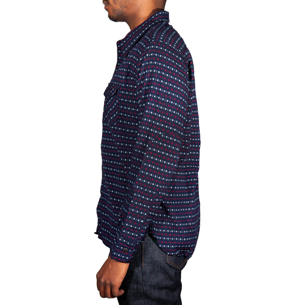 Man wearing a patterned shirt on a white background