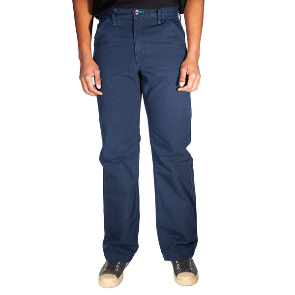 Navy blue pants worn by a person on a white background