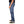 Person wearing blue jeans and black sneakers on a white background