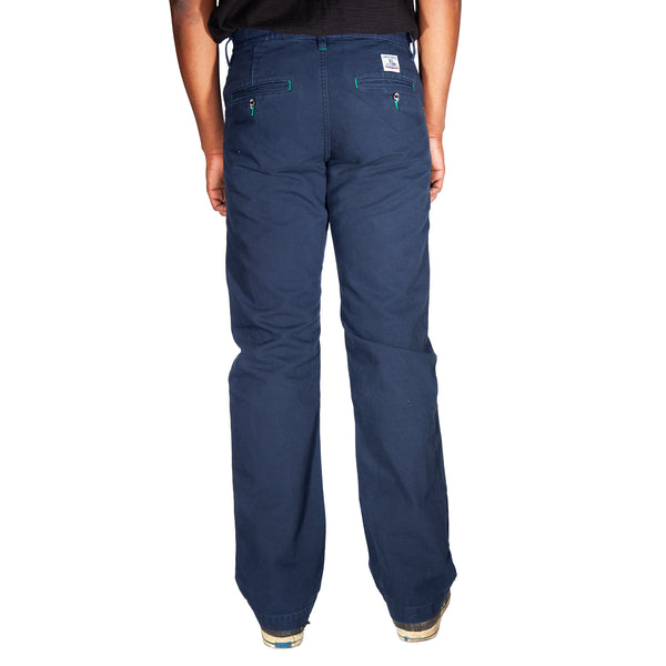 Navy blue pants worn by a person on a white background