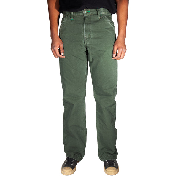 Person wearing green pants on a white background
