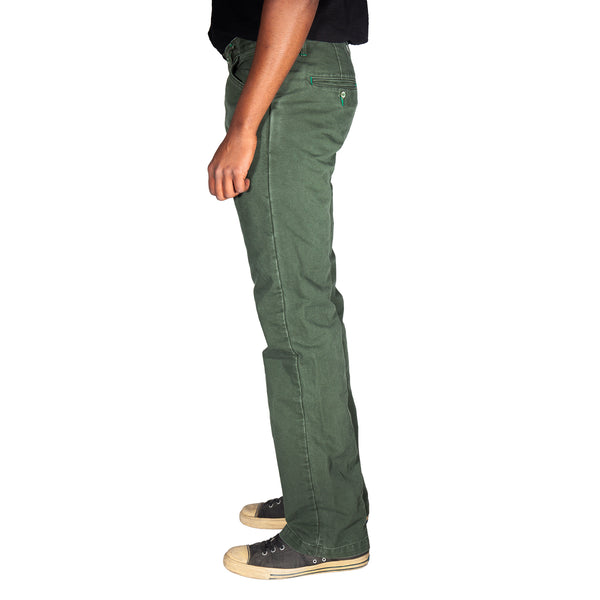 Green pants worn by a person on a white background