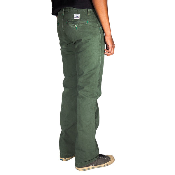 Green pants worn by a person on a white background