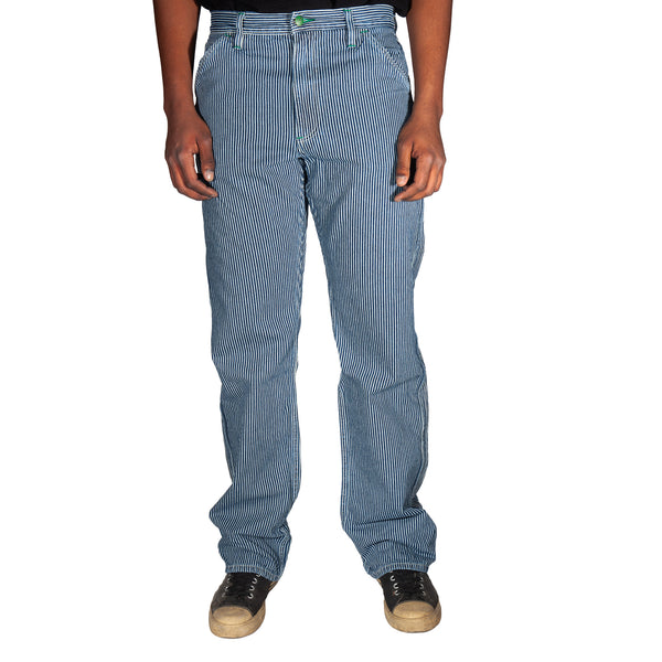 Blue striped pants worn by a person on a white background