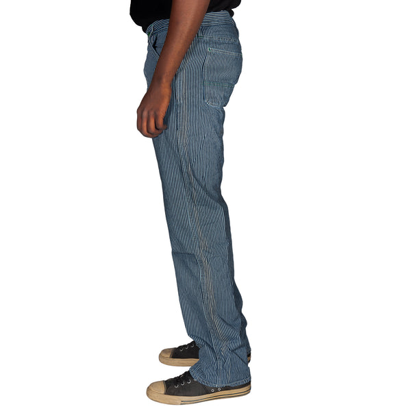 Person wearing blue striped pants on a white background