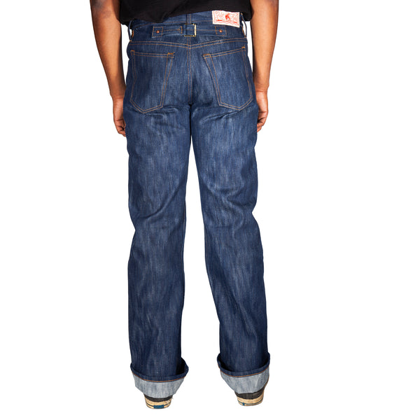 Blue jeans worn by a person on a white background