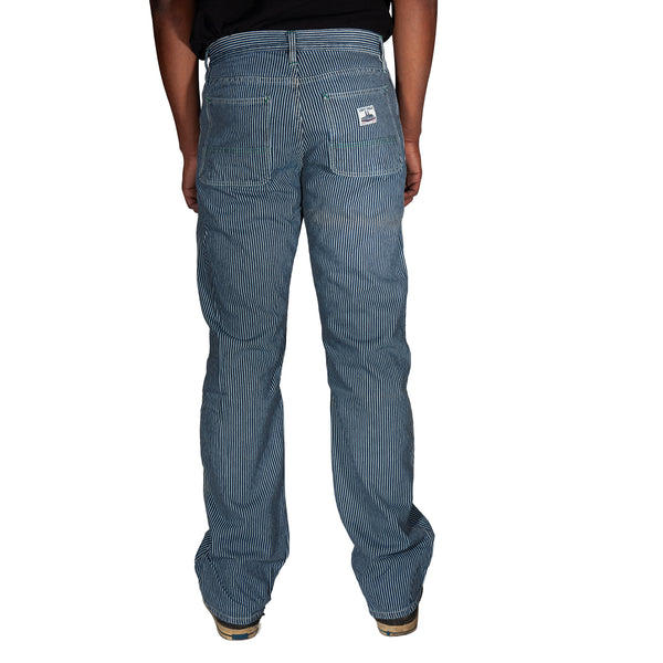 Blue striped pants worn by a person on a white background