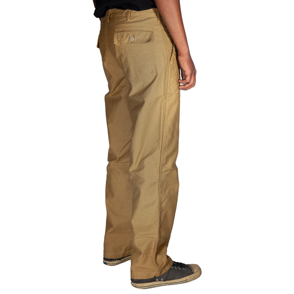 Tan pants worn by a person on a white background