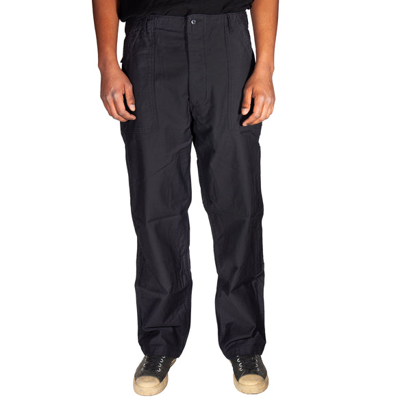 Black pants worn by a person on a white background