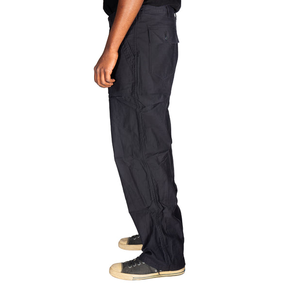 Black cargo pants worn by a person on a white background