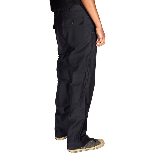 Black pants worn by a person on a white background