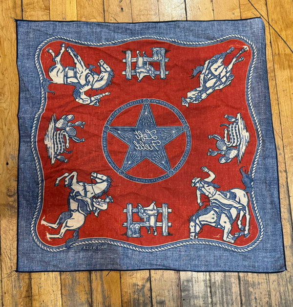 A red and blue bandana with a rotary print featuring horses cowboy and the brand 'Left Field' backside