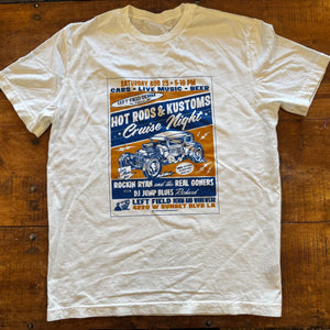 White t-shirt with a graphic design on a wooden surface