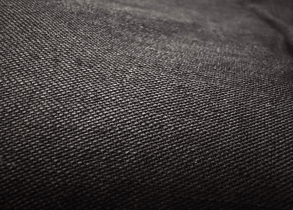 A pair of black chino trousers with front and back patch pockets