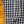 Close-up of a blue and white checkered shirt on a wooden surface