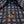 Close-up of a patterned shirt with a gold button