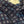 Close-up of a patterned fabric with a visible brand label.