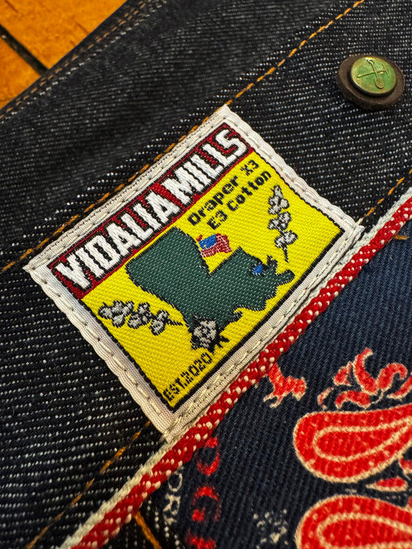 Vidalia Mills label on a denim fabric with a colorful design.