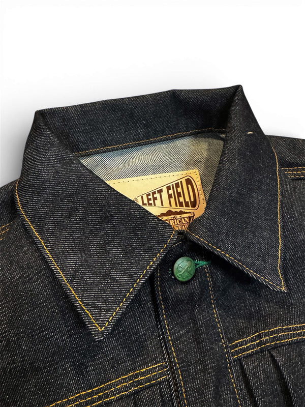 Denim jacket with a brand label on a white background