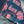 Close-up of denim fabric with red paisley pattern and 'Edge Denim' branding.