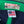 Close-up of a green and navy cap with 'Left Field' label and 'Made in USA' tag.