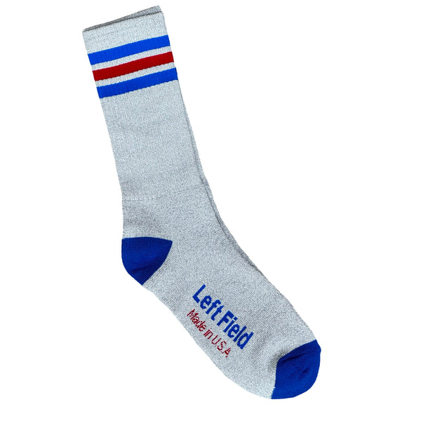 A pair of grey striped bamboo tube socks with blue and red accents, displayed with the brand label 'Left Field' visible.