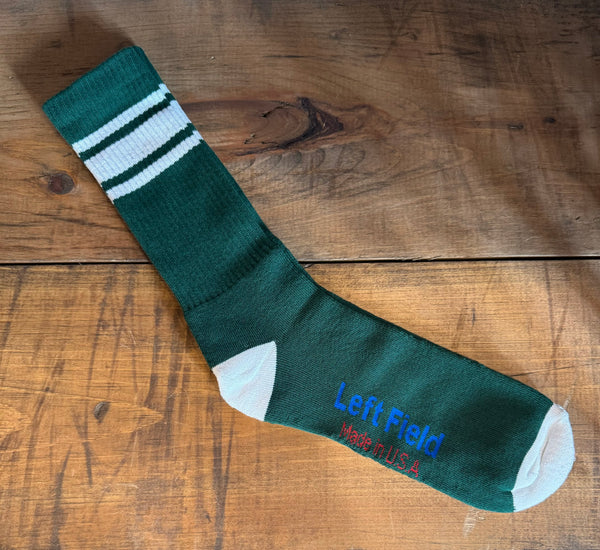  pair of green and white striped bamboo tube socks with the brand label 'Left Field NYC' displayed at the top.