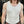 A white Japanese drop needle tank top with a slubby textured fabric,