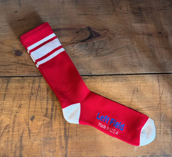  pair of red and white striped bamboo tube socks with the brand label 'Left Field NYC' displayed at the top.
