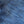 A pair of folded blue denim jeans with a label visible on the waistband.