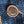 A pair of folded blue denim jeans with a label visible on the waistband.