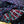 Close-up of patterned fabric with red, white, and blue colors on a wooden surface.