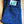 Folded blue jeans with a brand label on a wooden surface