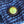 Close-up of a button on blue textured fabric