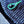 Close-up of a blue textured fabric with a green embroidered design.