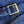 Close-up of a blue textured fabric with a gold buckle.