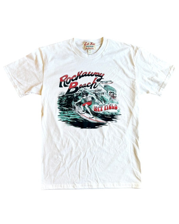 White crew neck t-shirt with a graphic print of a surfer and the text 'Rockaway Beach Surf Club' on the front.