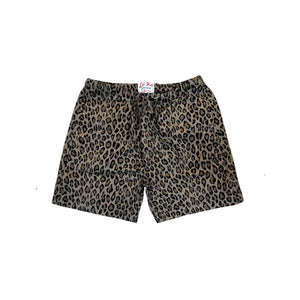 A pair of leopard print shorts with a drawstring waistband, laid flat on a white background.