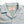 A pale blue short-sleeved camp shirt with Trocus pearl buttons and a collar, displayed against a white background.