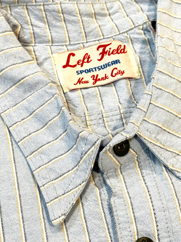 Close-up of a striped shirt with a 'Left Field Sportswear New York City' label.