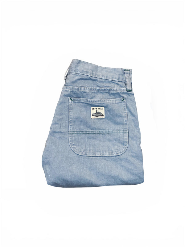 Light blue denim skirt with a brand label on a white background