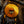 Close-up of a rusted metal button on dark fabric