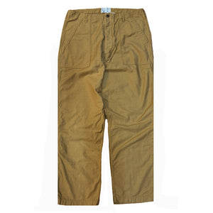 A pair of beige chino pants with front and back patch pockets, high rise, and long button front fly.