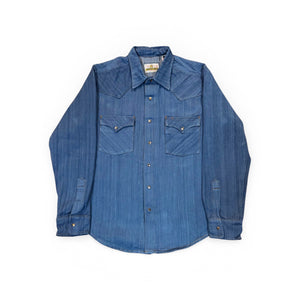 Blue denim shirt on a white background