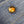 Close-up of a gold button on blue denim fabric