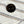 Black button with 'LEFT' text on a striped fabric background