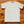 White t-shirt on a wooden surface