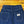 Blue jeans with a brand label on a wooden floor