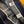 Close-up of a denim jacket with brand labels on a wooden surface